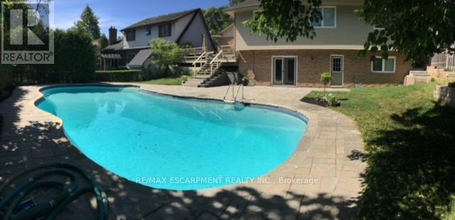 1995 Kerns Road, Burlington, ON - Outdoor With In Ground Pool