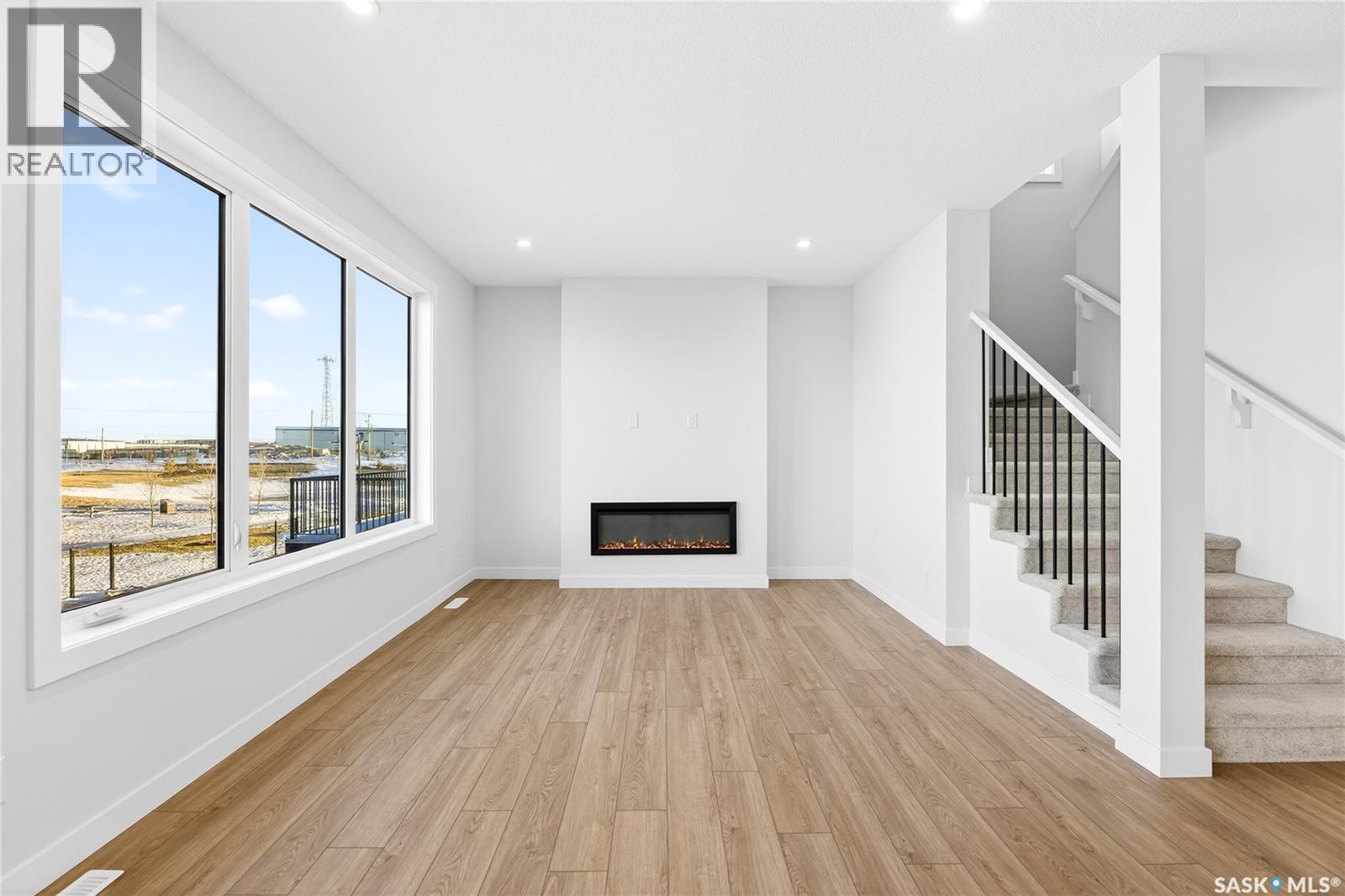 283 Nazarali Way, Saskatoon, SK - Indoor With Fireplace
