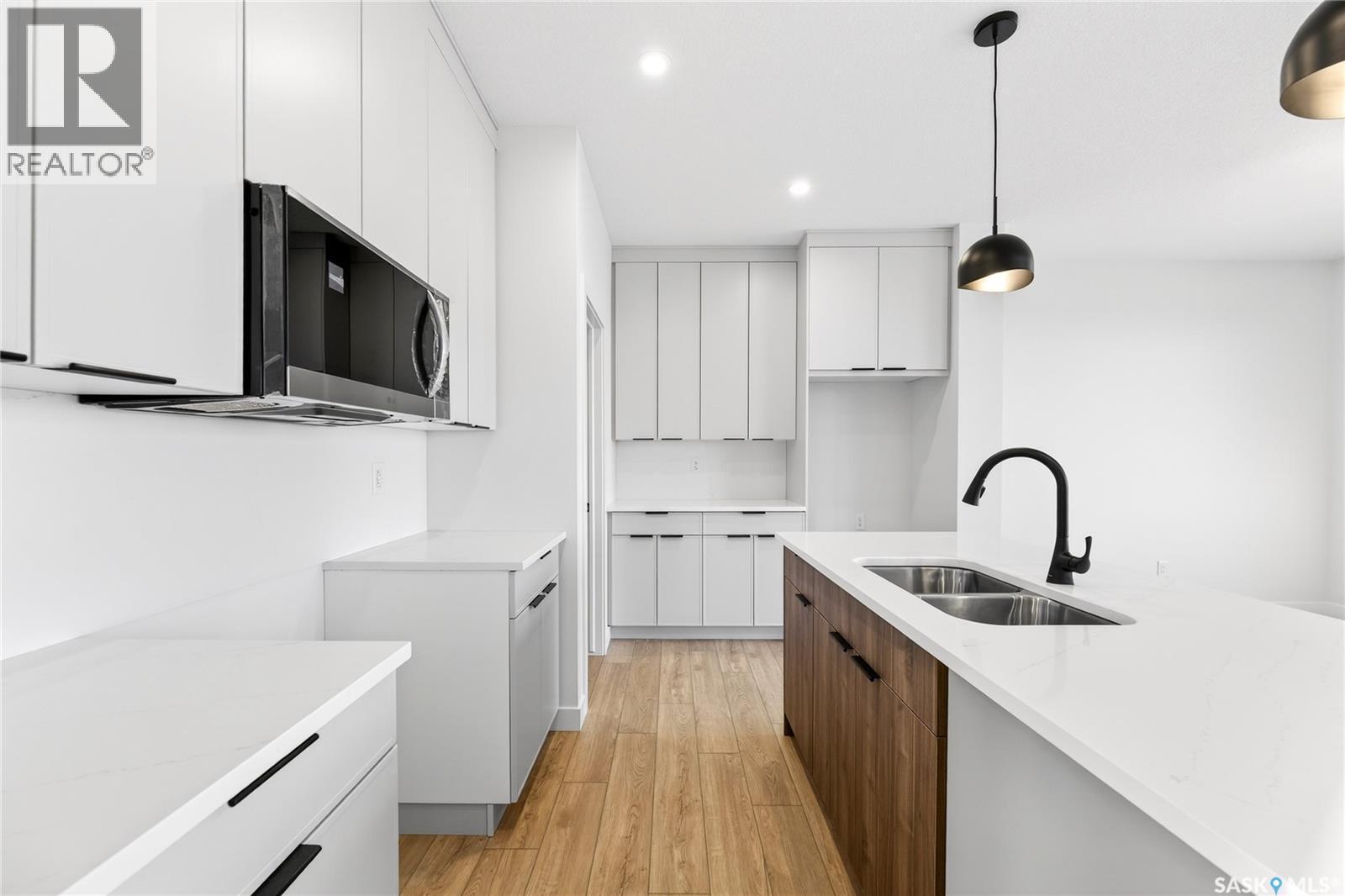 283 Nazarali Way, Saskatoon, SK - Indoor Photo Showing Kitchen With Double Sink