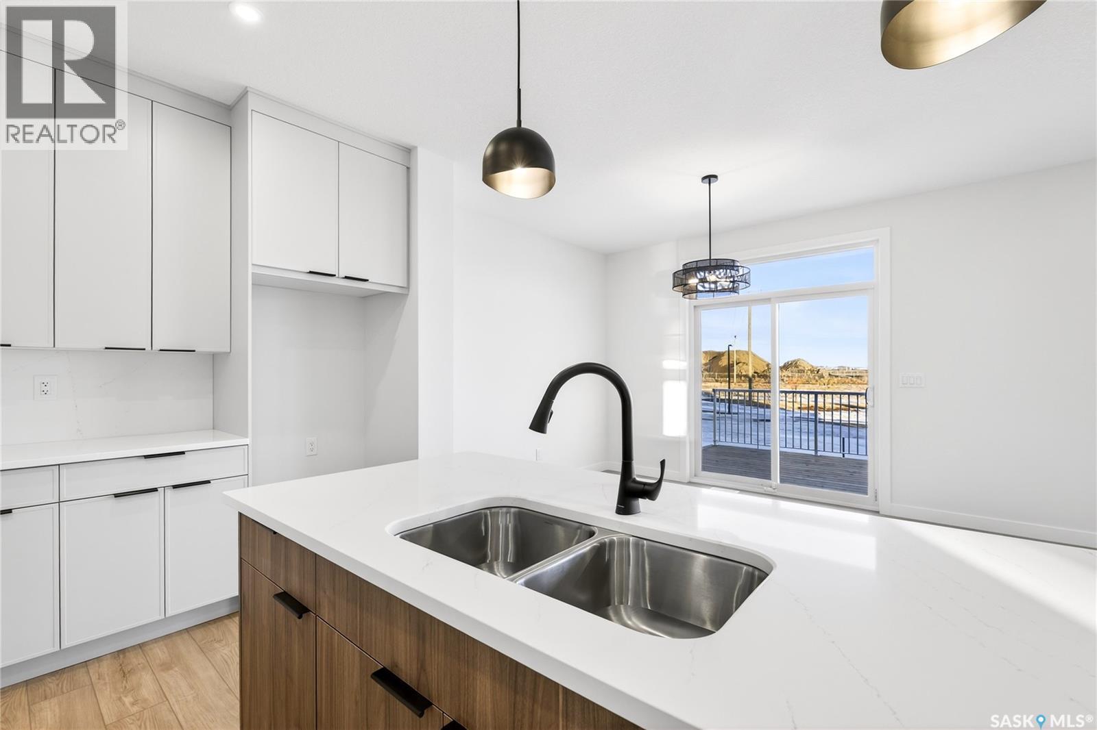 283 Nazarali Way, Saskatoon, SK - Indoor Photo Showing Kitchen With Double Sink