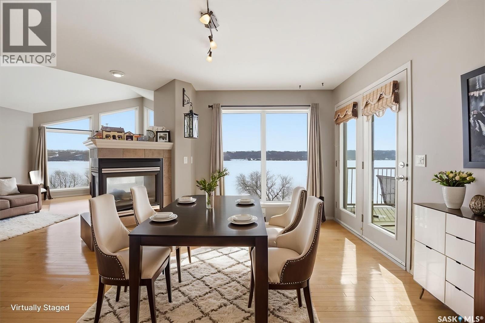 9 Pelican Pass, Thode, SK - Indoor Photo Showing Dining Room With Fireplace