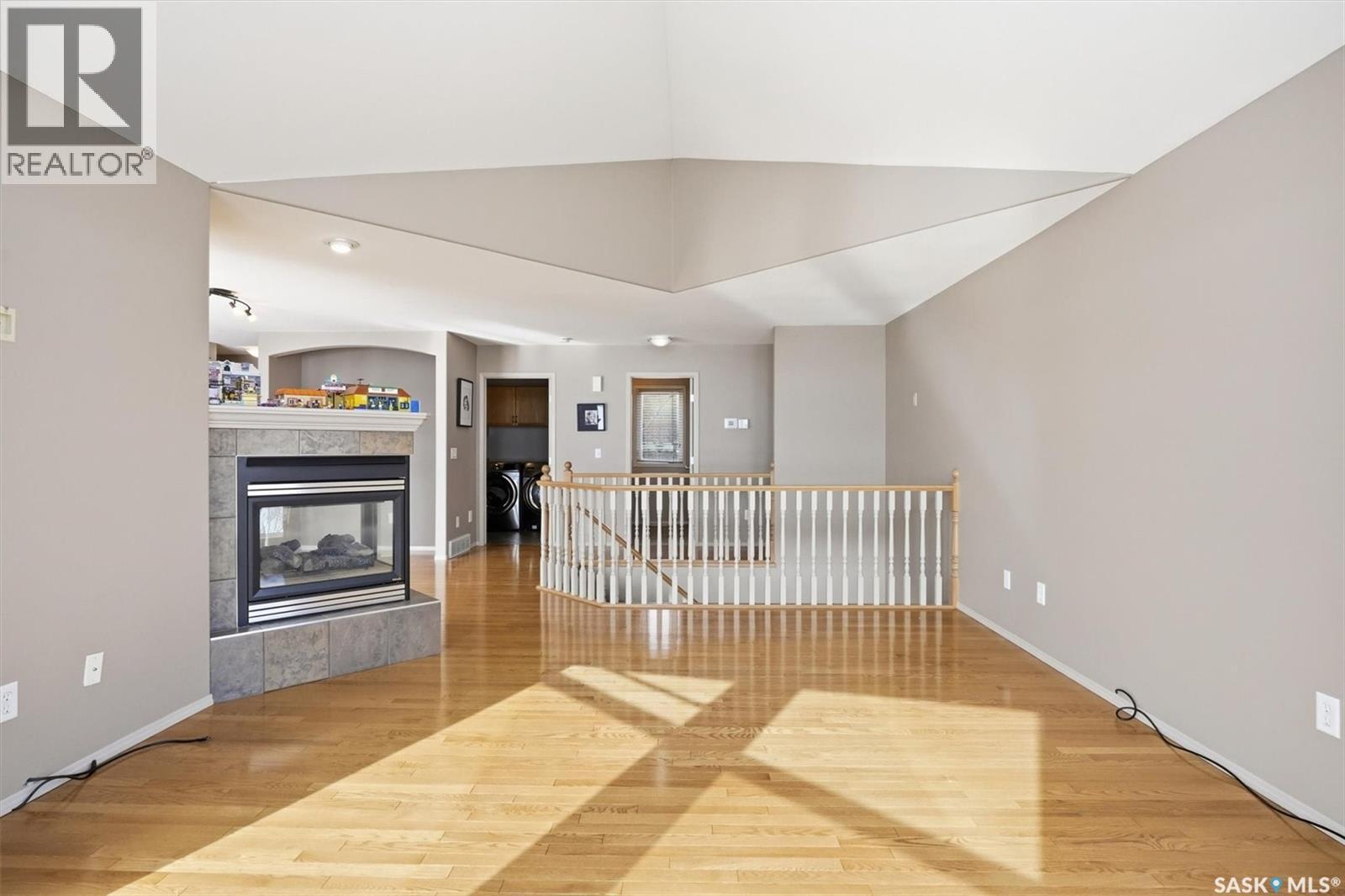 9 Pelican Pass, Thode, SK - Indoor Photo Showing Other Room With Fireplace