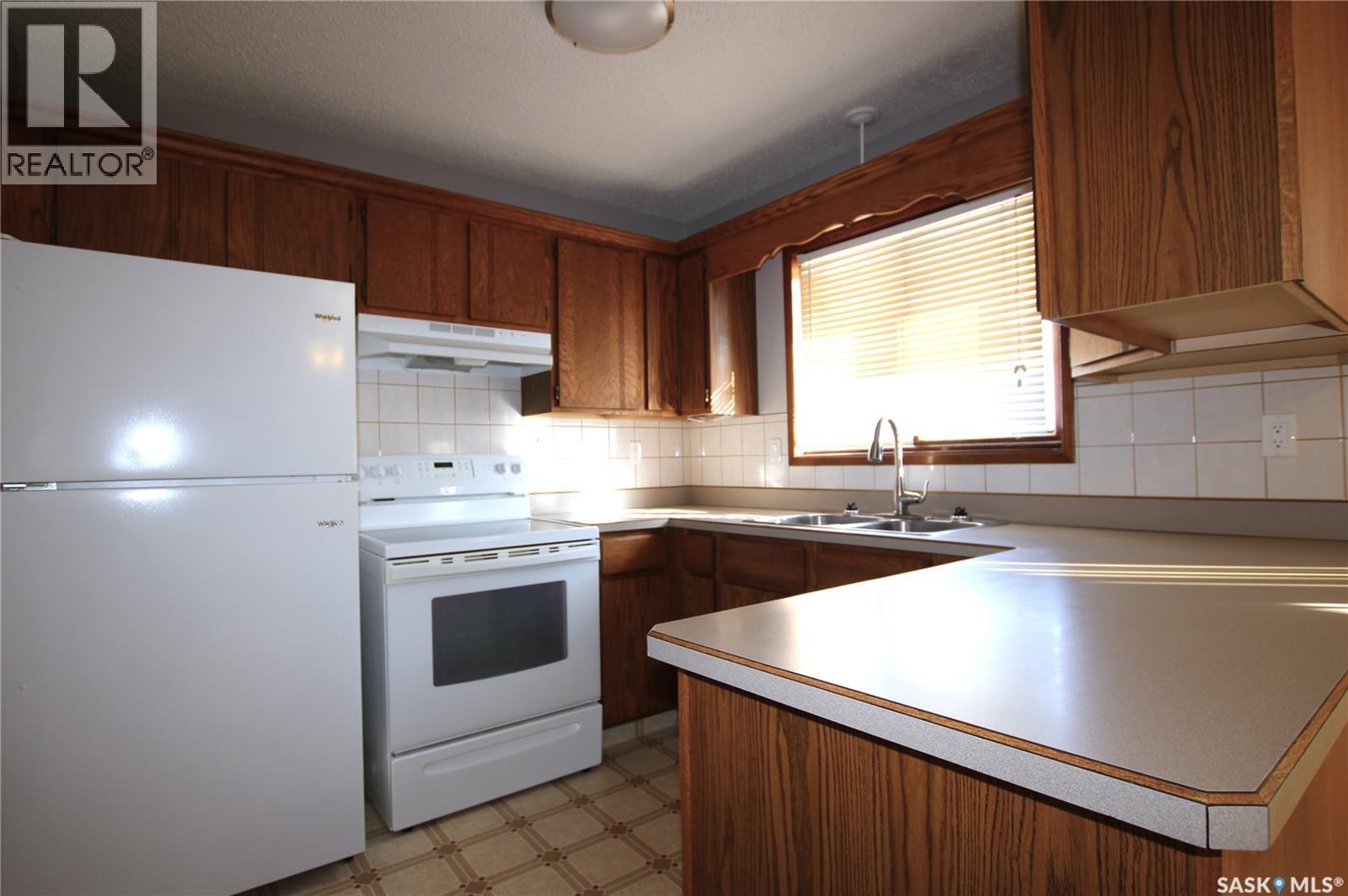 103 Langrill Drive, Yorkton, SK - Indoor Photo Showing Kitchen With Double Sink