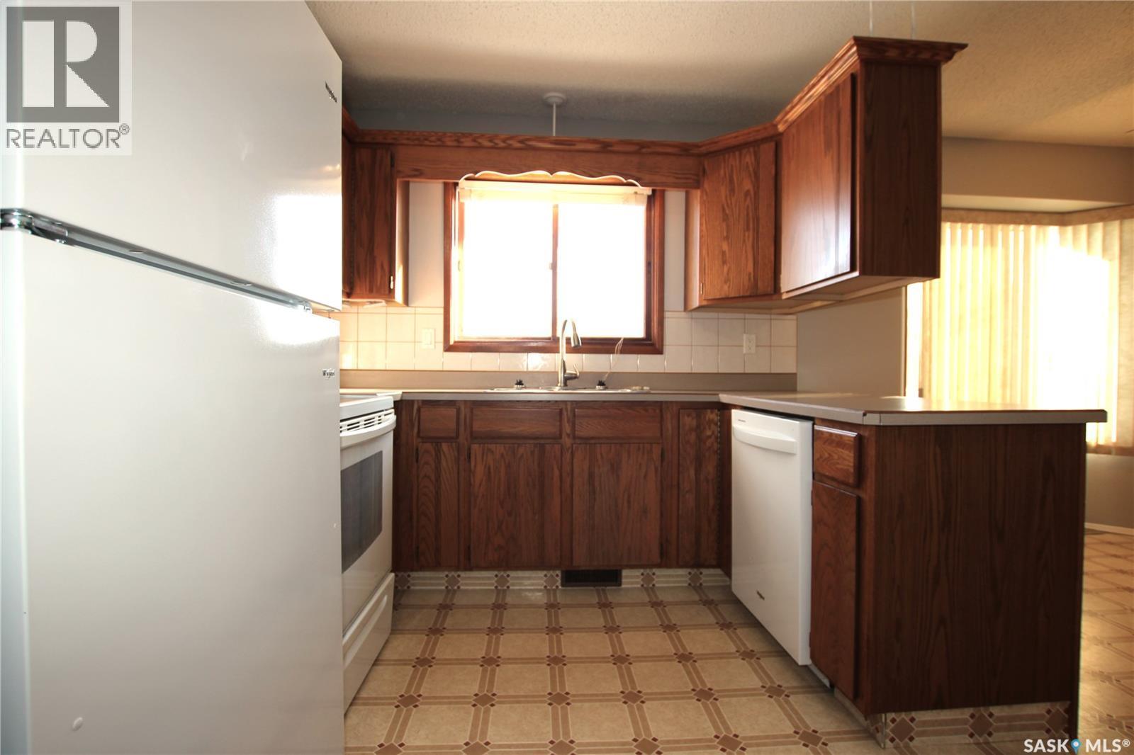 103 Langrill Drive, Yorkton, SK - Indoor Photo Showing Kitchen With Double Sink