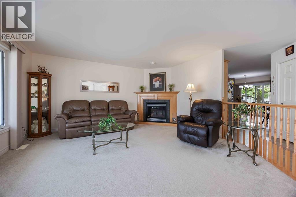 5700 Blackwell Sideroad Unit# 143, Sarnia, ON - Indoor Photo Showing Living Room With Fireplace