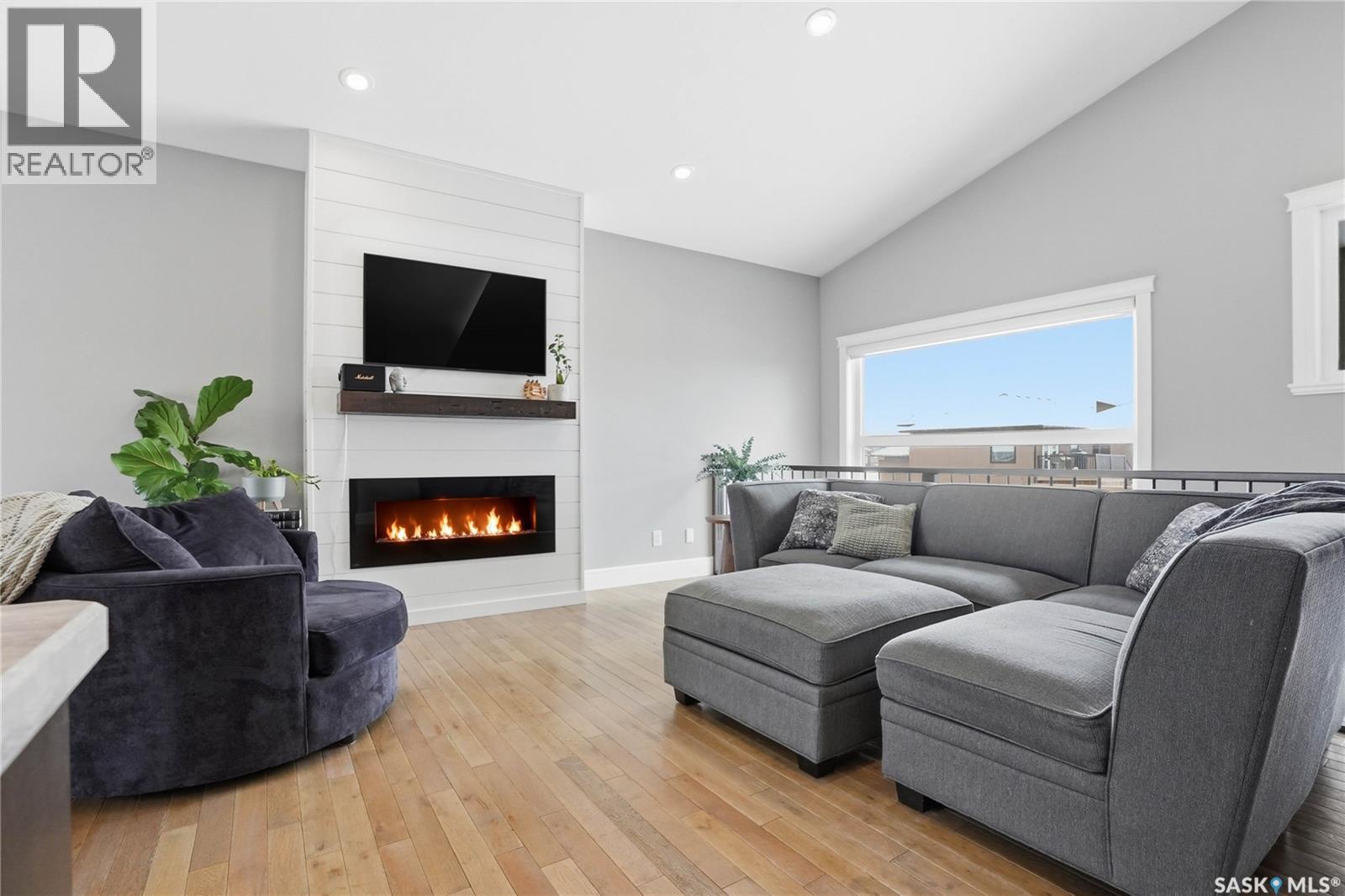 504 Snead Lane, Warman, SK - Indoor Photo Showing Living Room With Fireplace