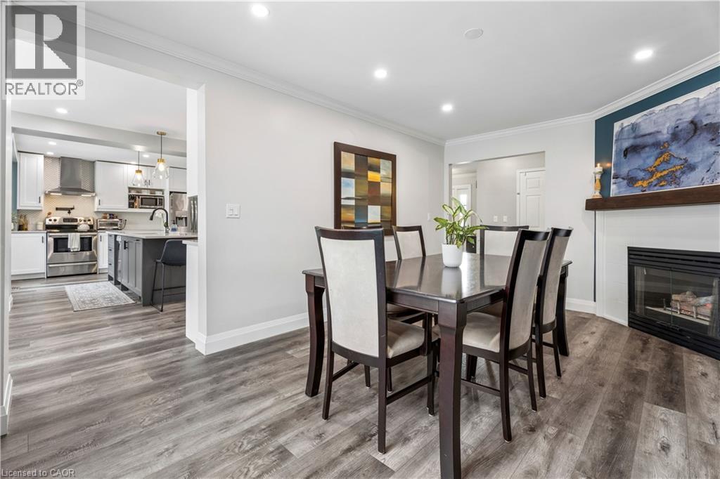 18 Marisa Court, Hamilton, ON - Indoor Photo Showing Dining Room With Fireplace