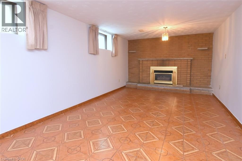 36 Glassco Avenue N, Hamilton, ON - Indoor With Fireplace