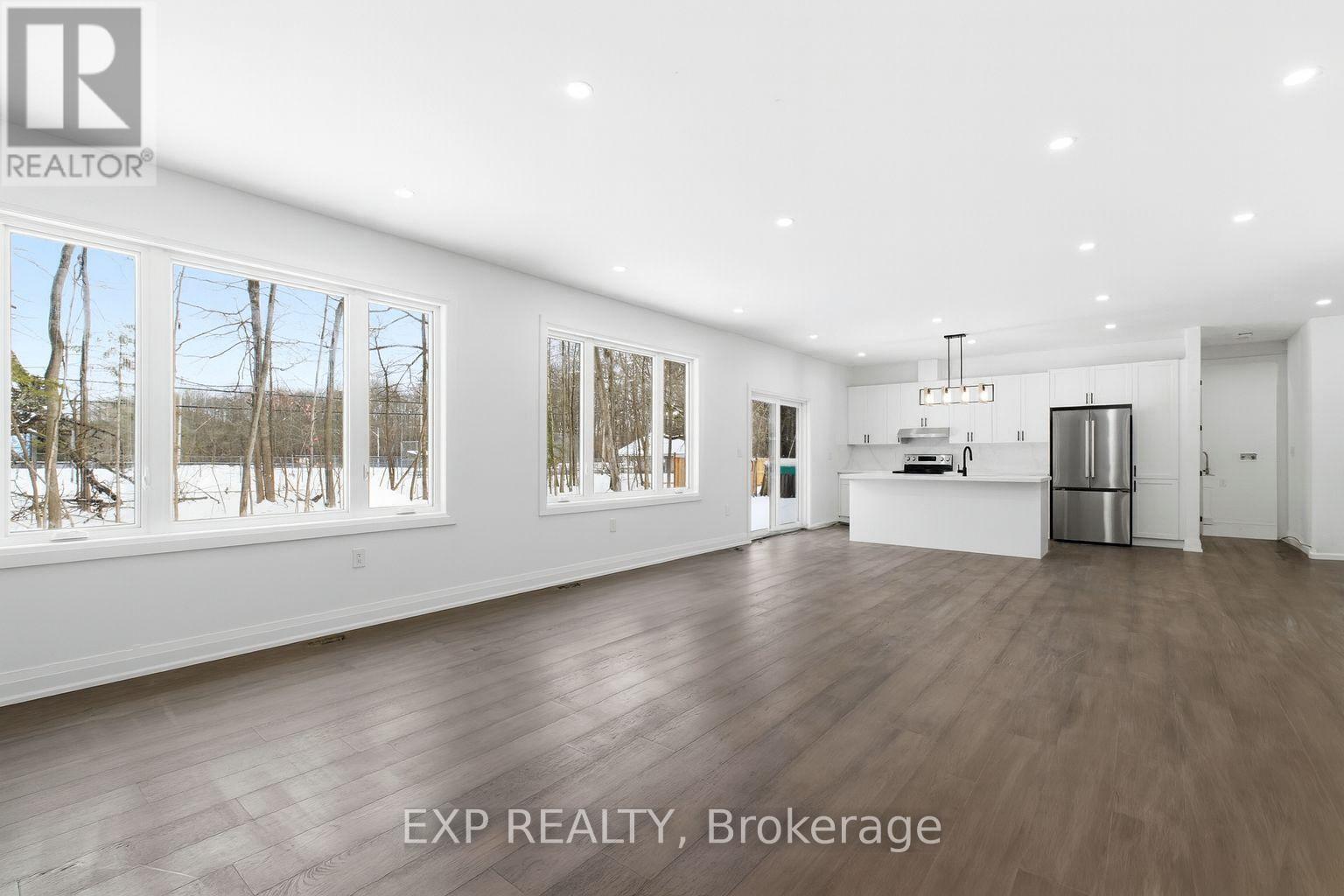 Living/dining/kitchen view from Living room - 49 Beaufort Crescent, Tiny, ON - Indoor Photo Showing Other Room