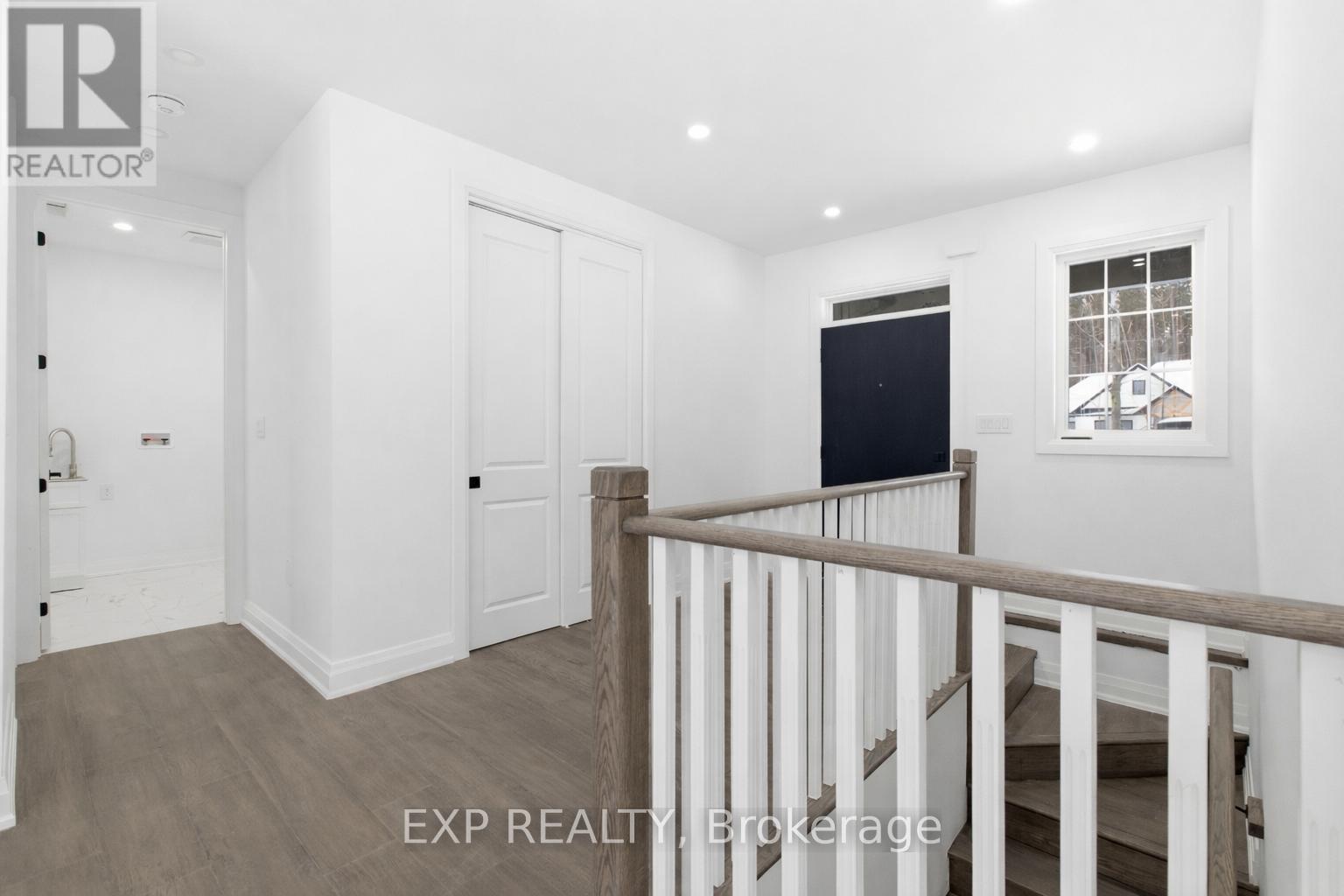 Entrance, stairs to basement, hallway to mudroom - 49 Beaufort Crescent, Tiny, ON - Indoor Photo Showing Other Room