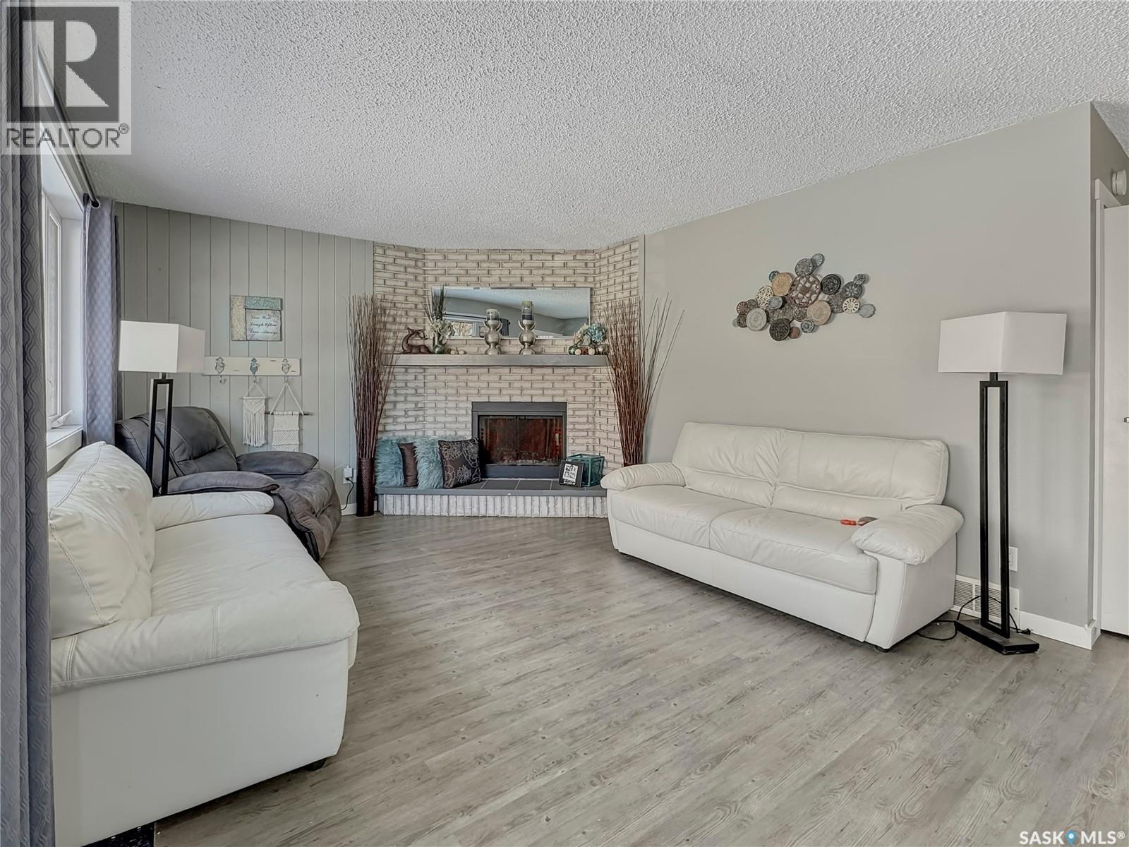 17 4Th Avenue E, Neilburg, SK - Indoor Photo Showing Living Room With Fireplace