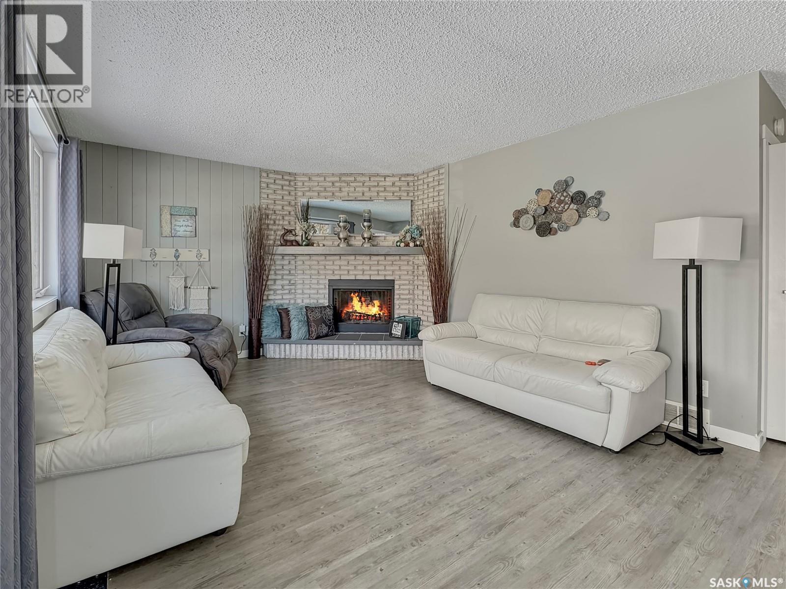 17 4Th Avenue E, Neilburg, SK - Indoor Photo Showing Living Room With Fireplace