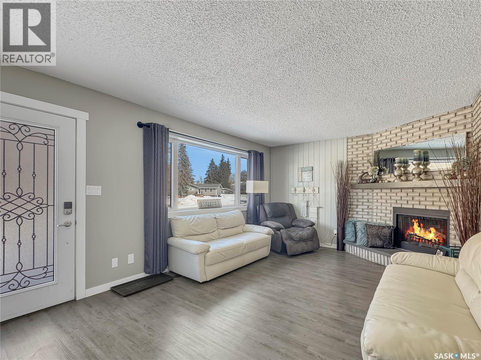 17 4Th Avenue E, Neilburg, SK - Indoor Photo Showing Living Room With Fireplace