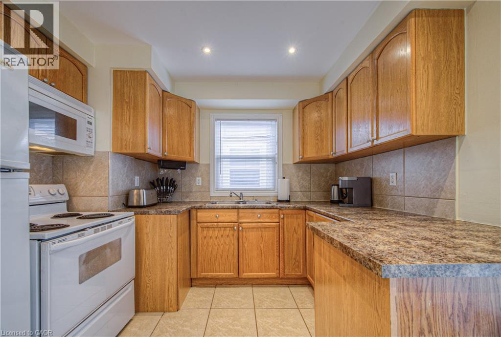 100 Reid Avenue S, Hamilton, ON - Indoor Photo Showing Kitchen With Double Sink
