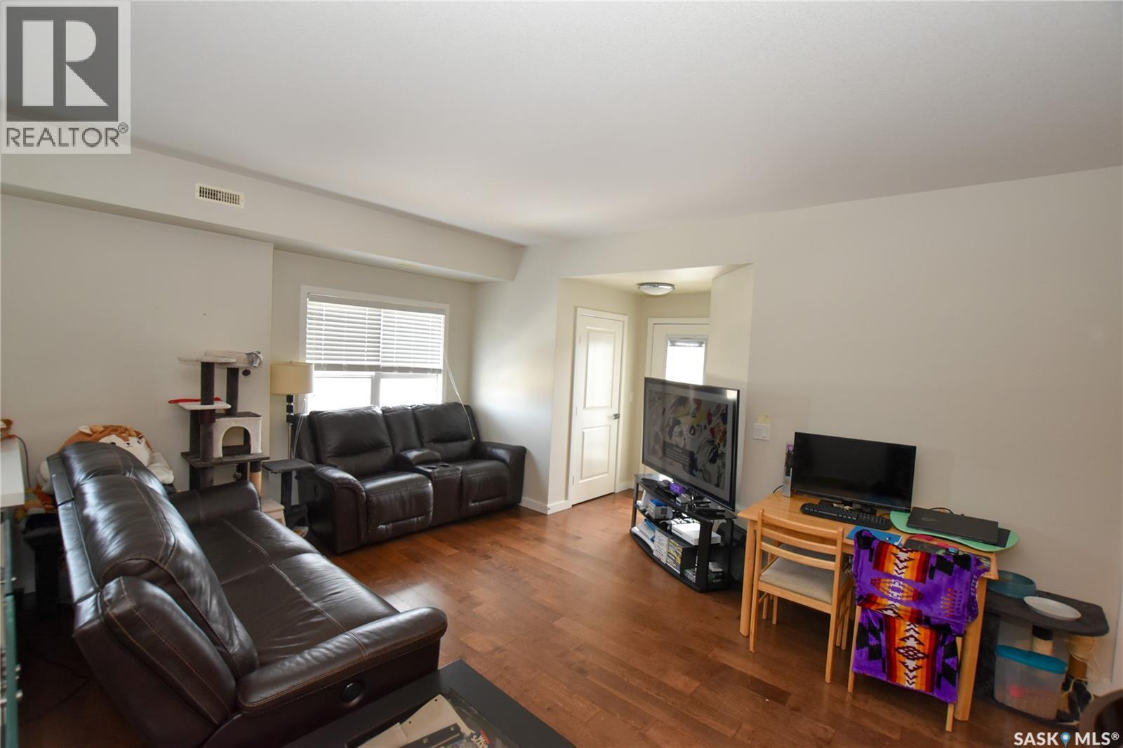204 2315 Mcclocklin Road, Saskatoon, SK - Indoor Photo Showing Living Room