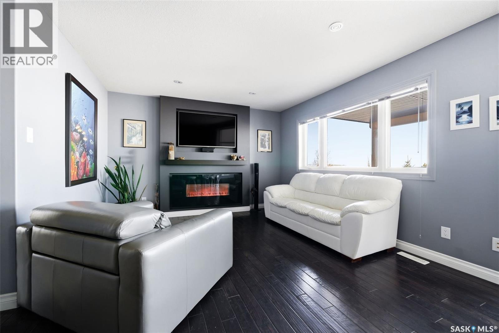 130 E Maple Avenue, Grand Coulee, SK - Indoor Photo Showing Living Room With Fireplace