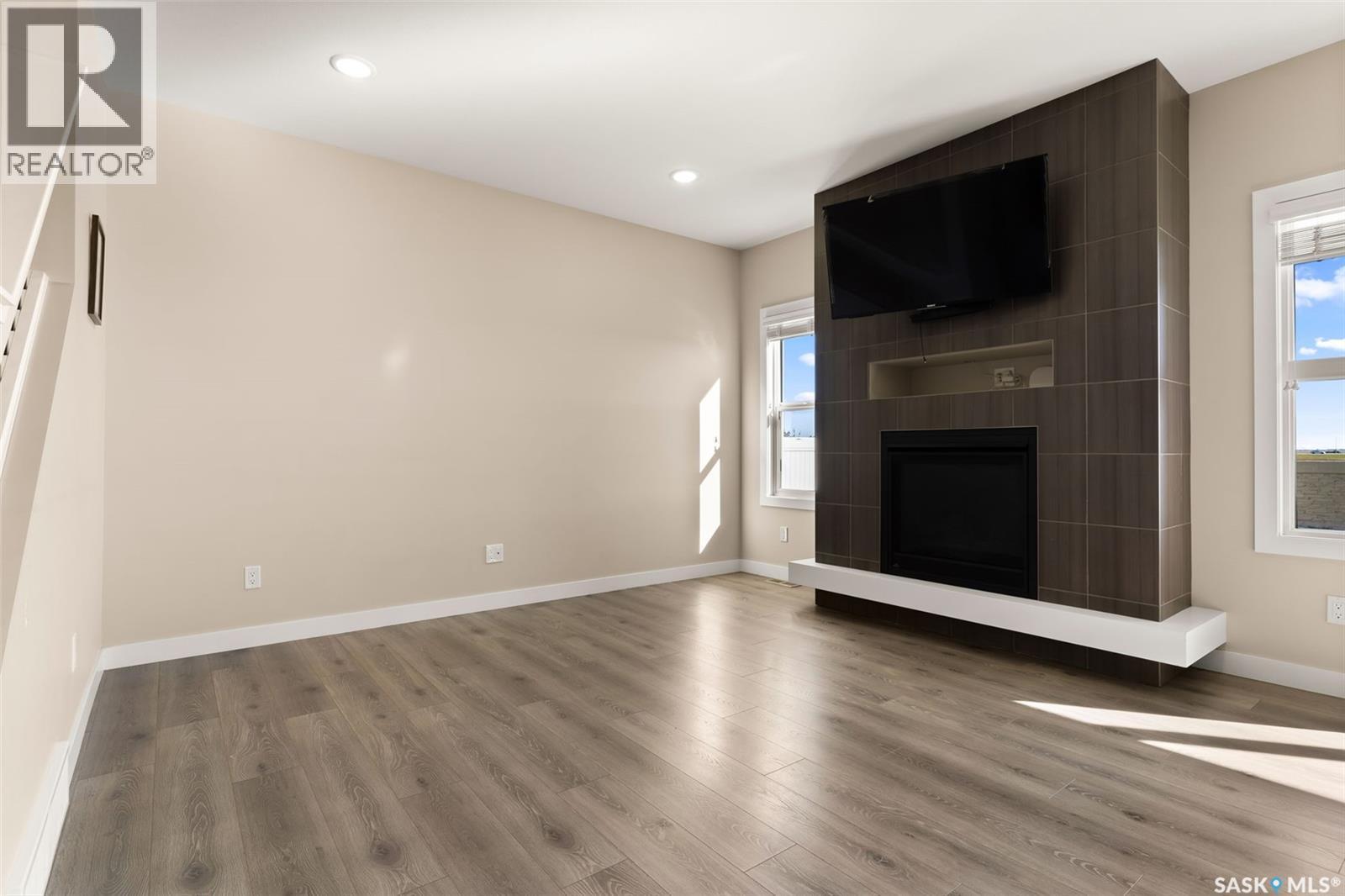3523 Green Turtle Road, Regina, SK - Indoor Photo Showing Other Room With Fireplace