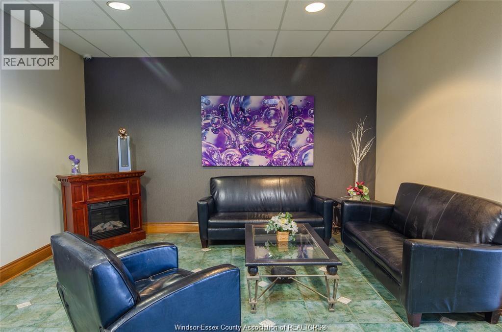 540 Ouellette Unit# 3F, Windsor, ON - Indoor Photo Showing Living Room With Fireplace