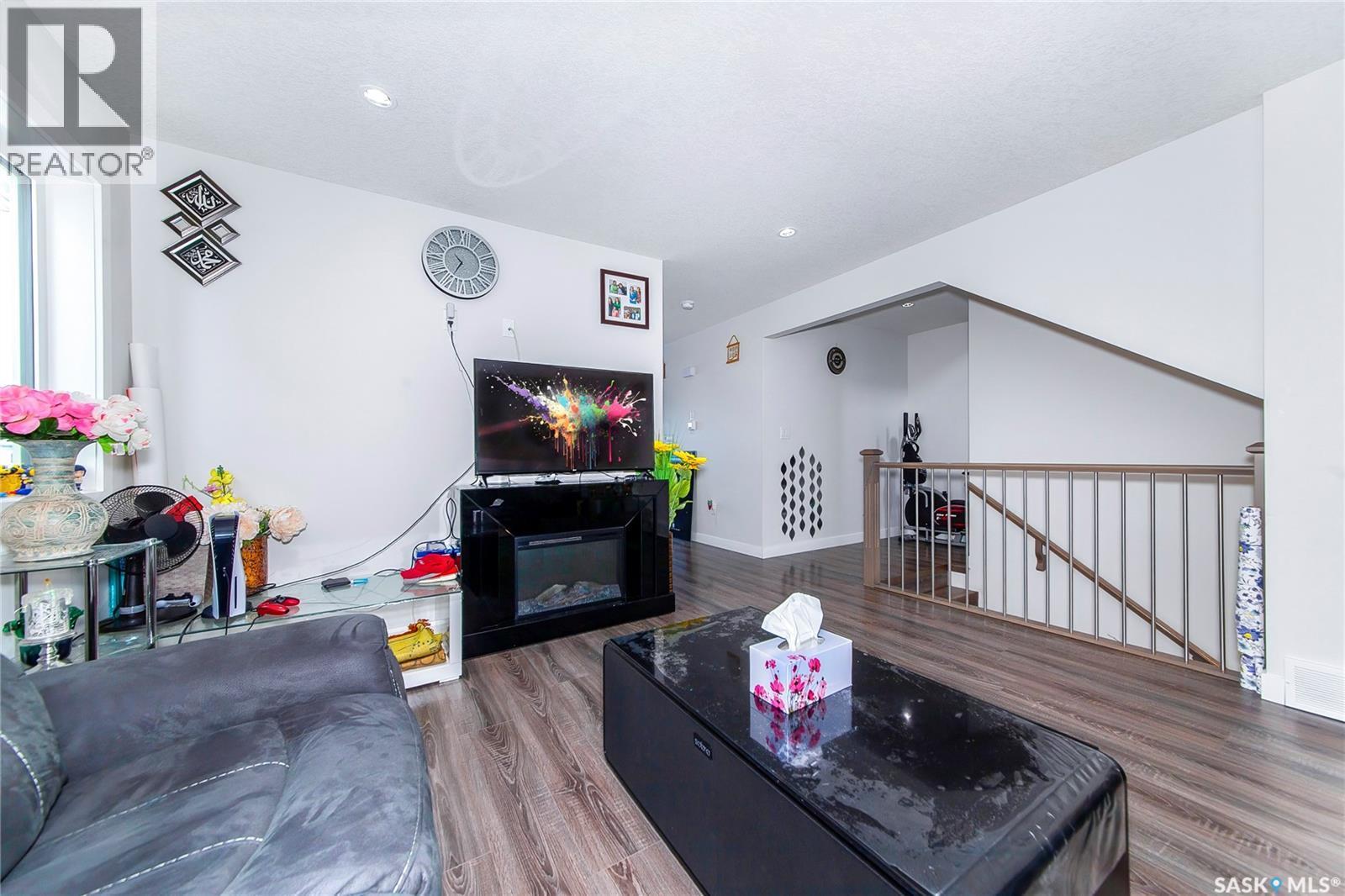 4166 Diefenbaker Drive, Saskatoon, SK - Indoor Photo Showing Other Room With Fireplace