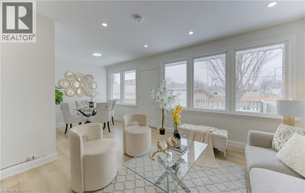 Living area featuring light wood-style floors and recessed lighting - 171 Sixth Avenue, Kitchener, ON - Indoor