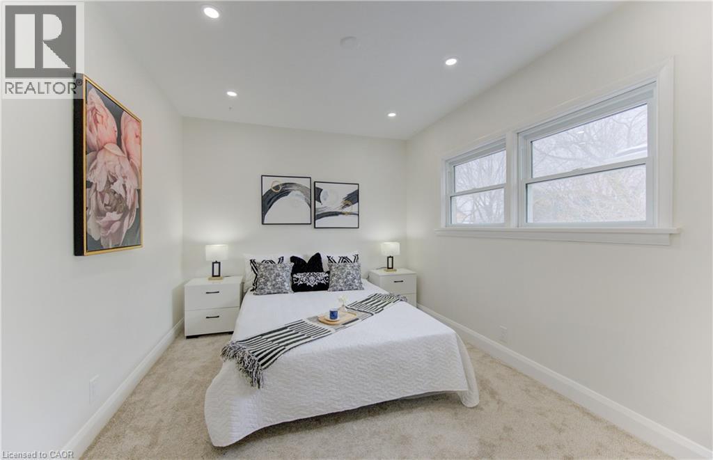 Bedroom featuring light carpet and recessed lighting - 171 Sixth Avenue, Kitchener, ON - Indoor Photo Showing Bedroom