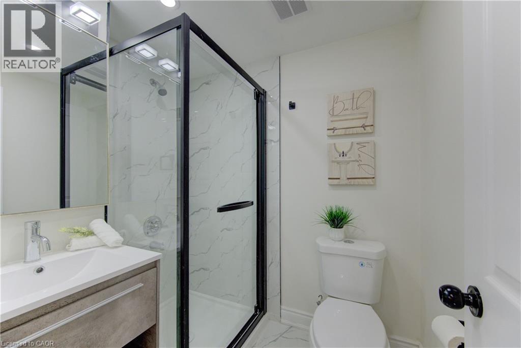 Bathroom with a marble finish shower, vanity, light marble finish floors, and recessed lighting - 171 Sixth Avenue, Kitchener, ON - Indoor Photo Showing Bathroom