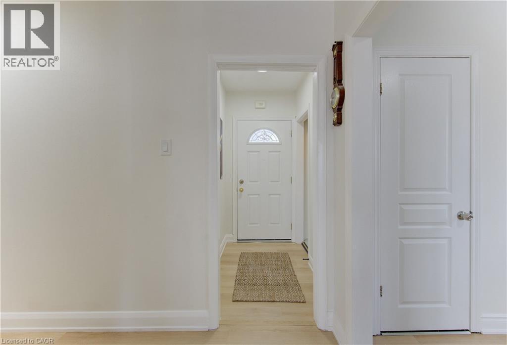 Doorway featuring baseboards and wood finished floors - 171 Sixth Avenue, Kitchener, ON - Indoor Photo Showing Other Room