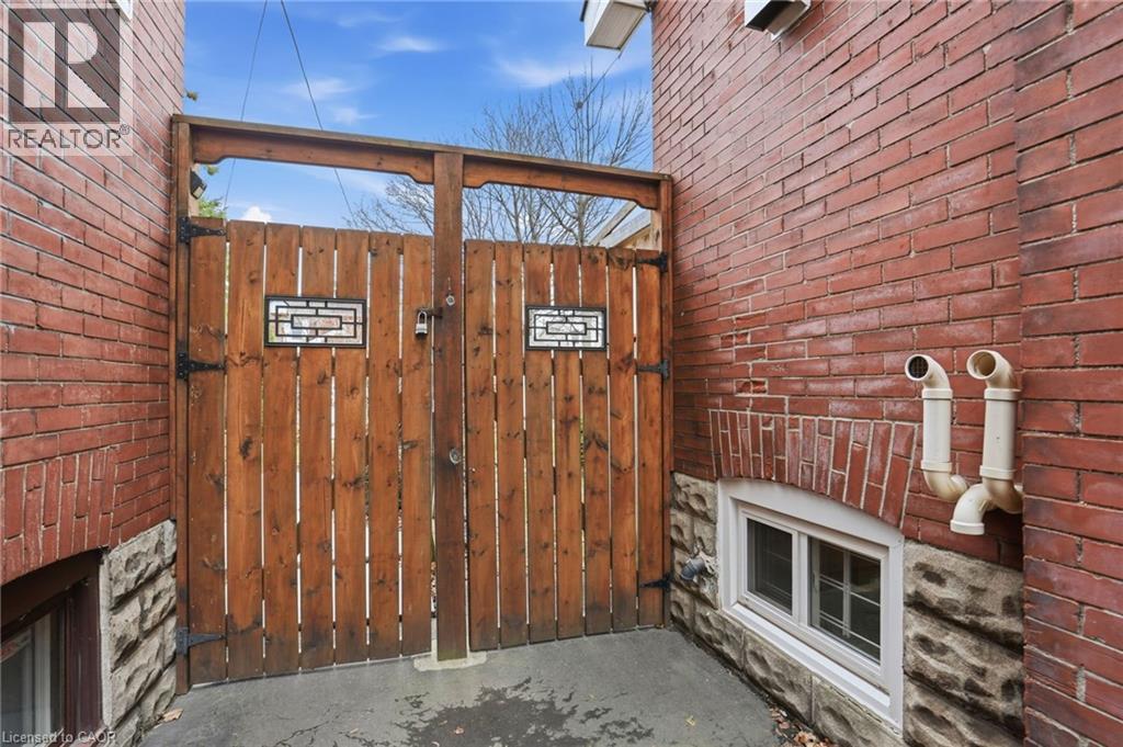 223 Park Row S, Hamilton, ON - Photo Showing Other Room With Fireplace