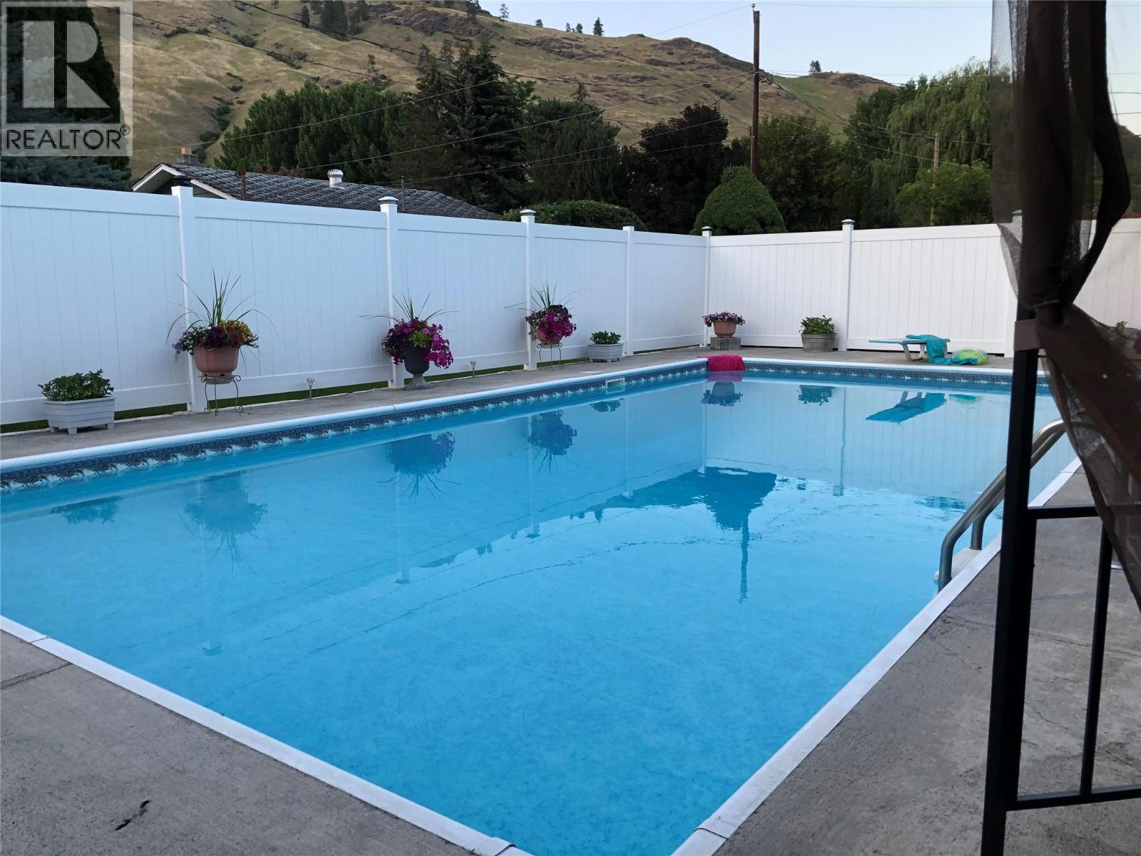 461 Eighth Avenue, Midway, BC - Outdoor With In Ground Pool With Backyard