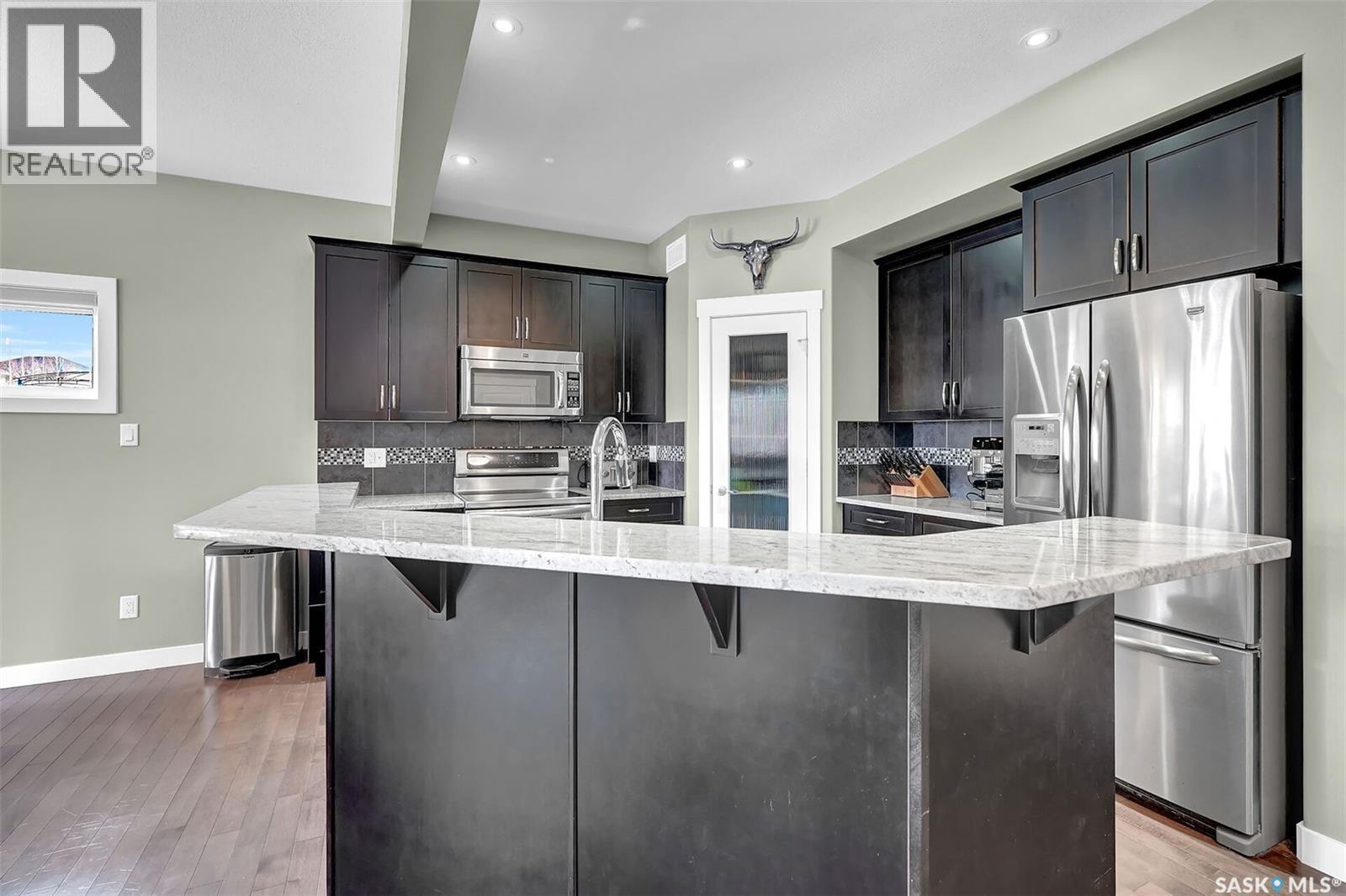 8856 Kestral Drive, Regina, SK - Indoor Photo Showing Kitchen With Stainless Steel Kitchen With Upgraded Kitchen