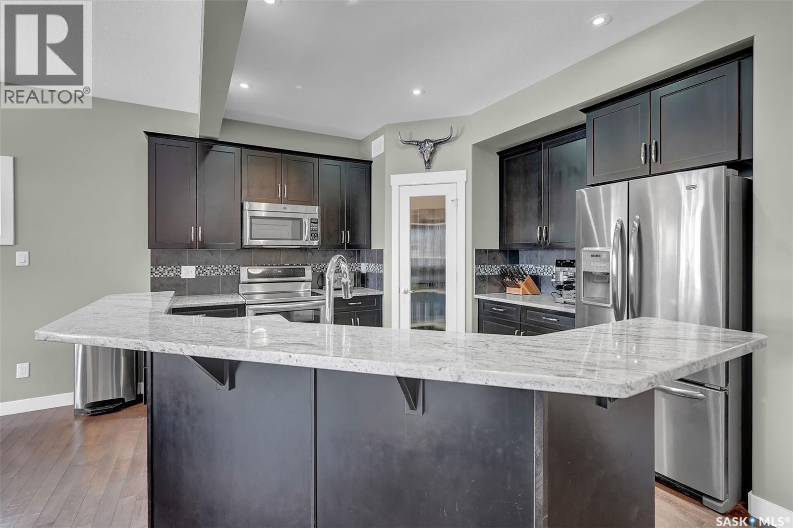 8856 Kestral Drive, Regina, SK - Indoor Photo Showing Kitchen With Stainless Steel Kitchen With Upgraded Kitchen