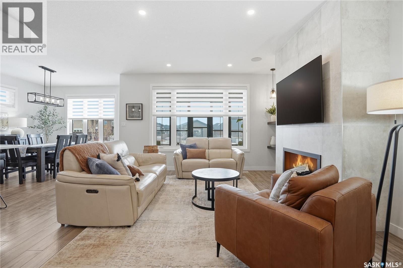 4418 Sage Crescent E, Regina, SK - Indoor Photo Showing Living Room With Fireplace