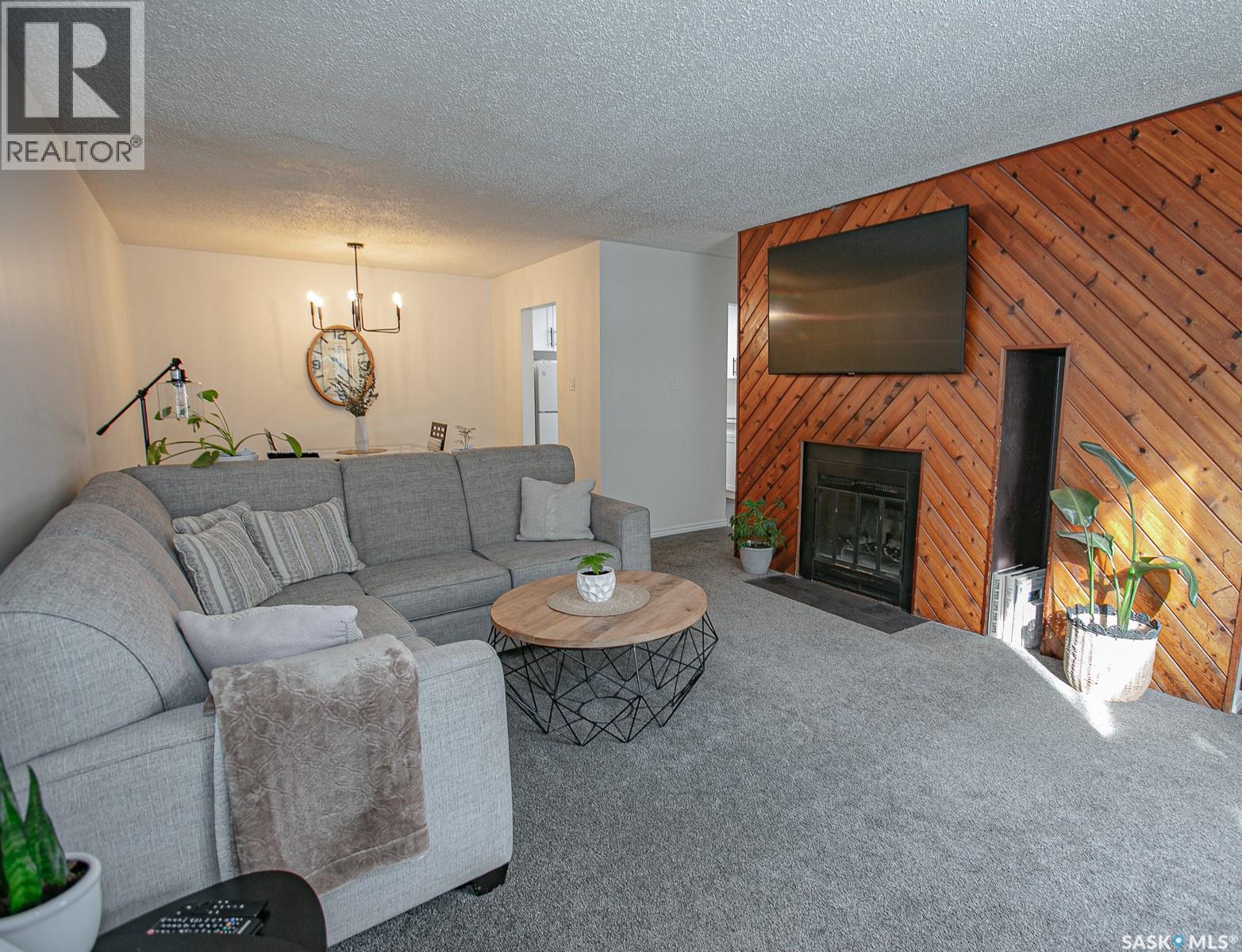 A 22 Nollet Avenue, Regina, SK - Indoor Photo Showing Living Room With Fireplace