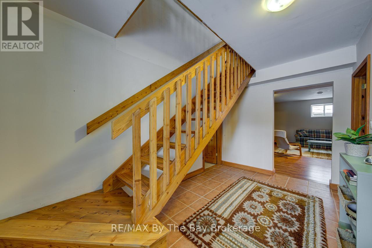 Stairs to Lower Level - 397 Silver Birch Drive, Tiny, ON - Indoor Photo Showing Other Room