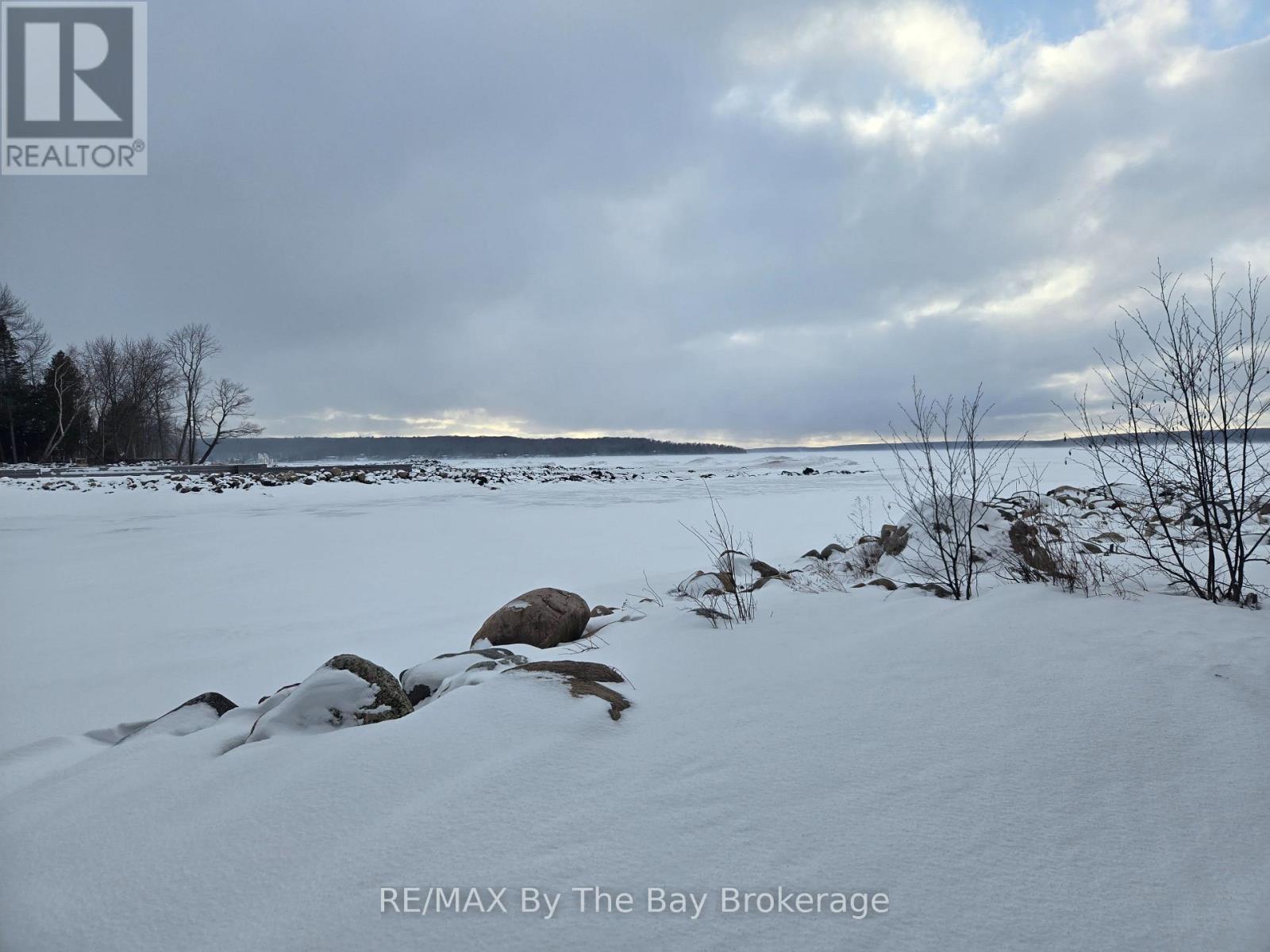 View from Lake access (Winter) - 397 Silver Birch Drive, Tiny, ON - Outdoor With Body Of Water With View