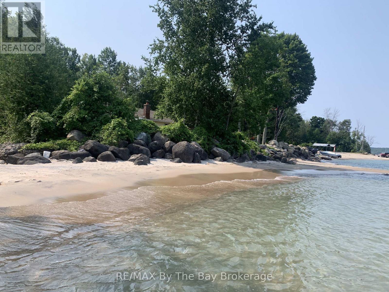 Beach from Lake access (Summer) - 397 Silver Birch Drive, Tiny, ON - Outdoor With Body Of Water With View