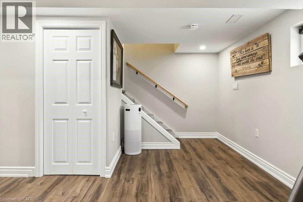 Staircase featuring wood finished floors and recessed lighting - 237 East 32Nd Street, Hamilton, ON - Indoor Photo Showing Other Room