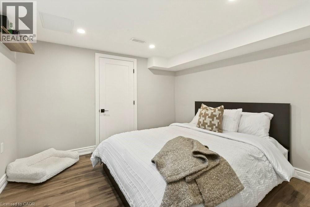 Bedroom with dark wood-style floors and recessed lighting - 237 East 32Nd Street, Hamilton, ON - Indoor Photo Showing Bedroom