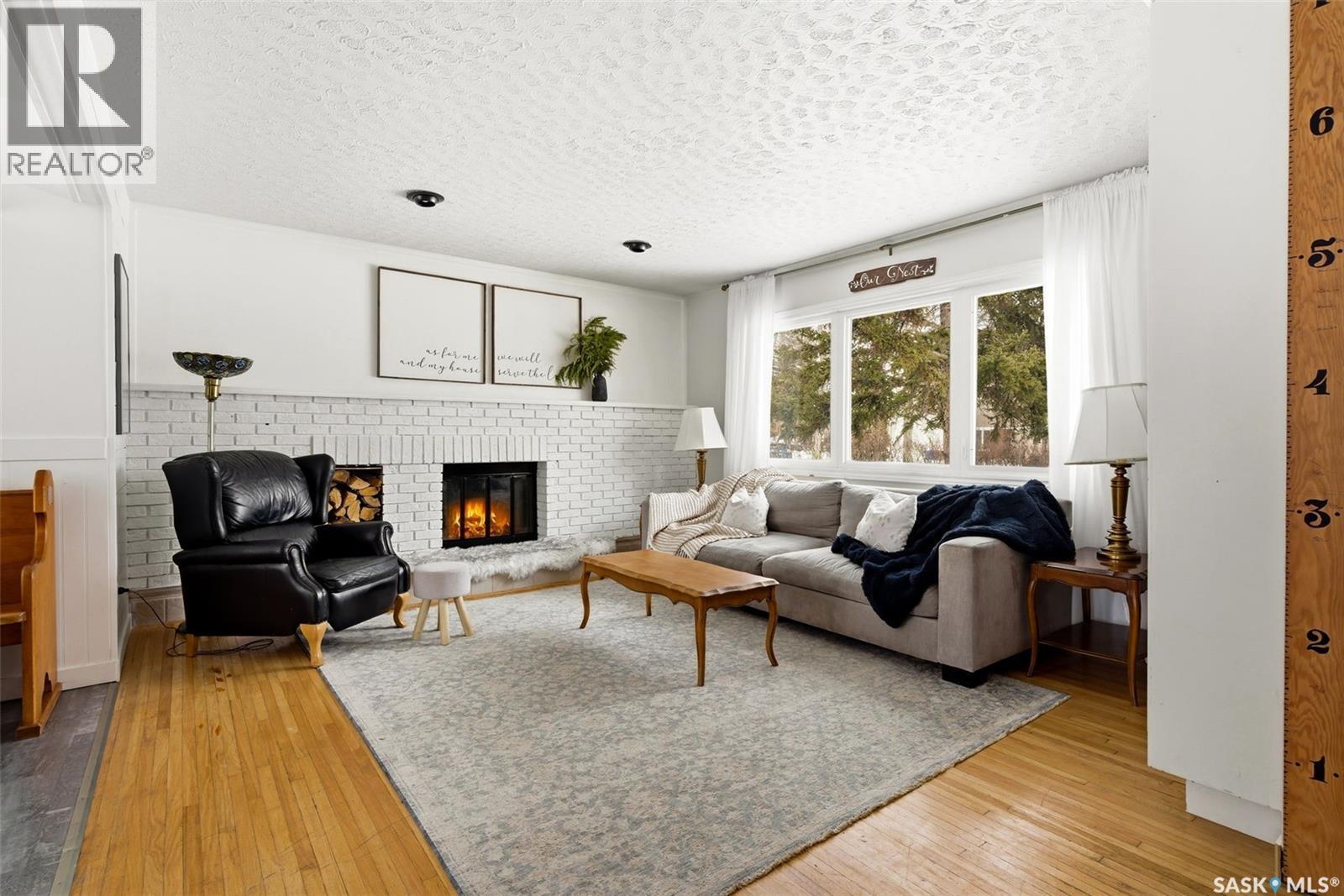 18 Marsh Crescent, Regina, SK - Indoor Photo Showing Living Room With Fireplace