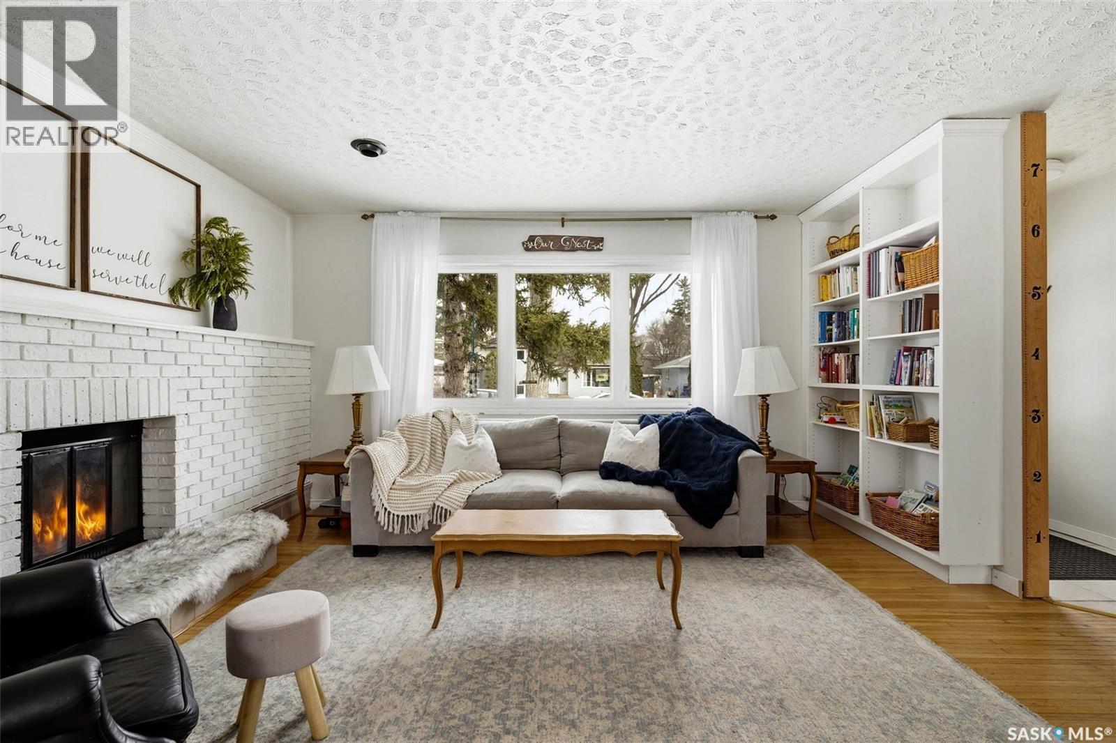 18 Marsh Crescent, Regina, SK - Indoor Photo Showing Living Room With Fireplace
