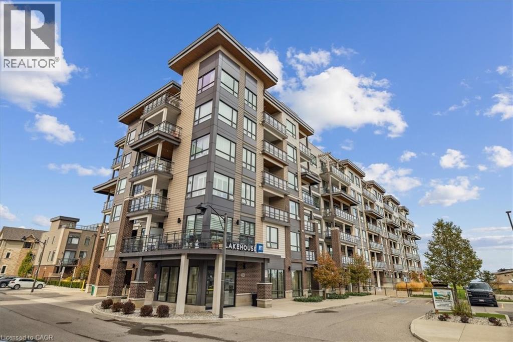 View of apartment building / complex - 40 Esplanade Lane Unit# 102, Grimsby, ON - Outdoor With Facade