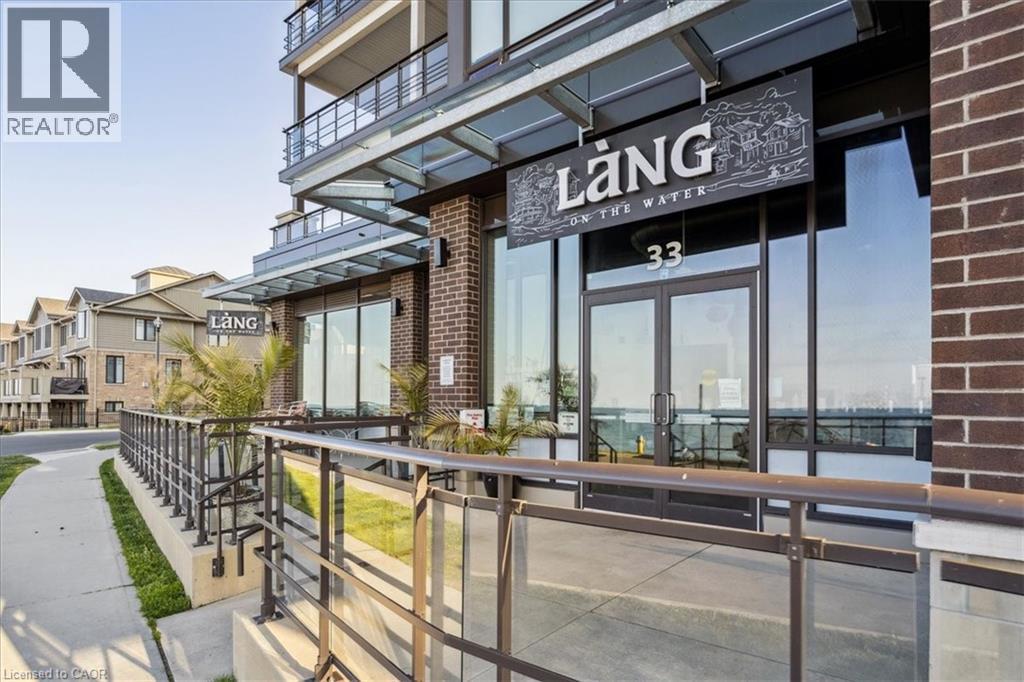 Entrance to property featuring brick siding and french doors - 40 Esplanade Lane Unit# 102, Grimsby, ON - Outdoor