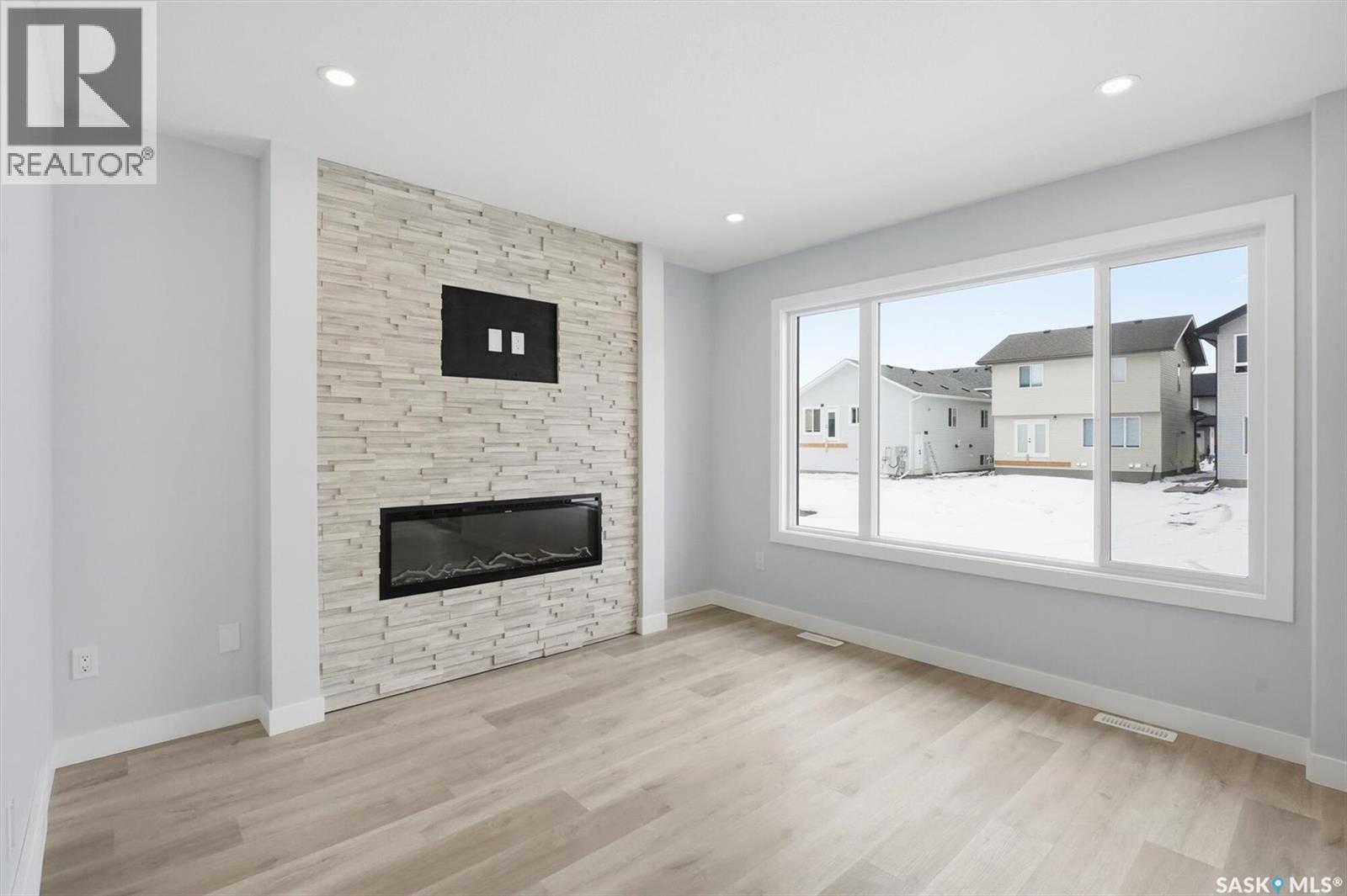 262 Kostiuk Crescent, Saskatoon, SK - Indoor Photo Showing Living Room With Fireplace