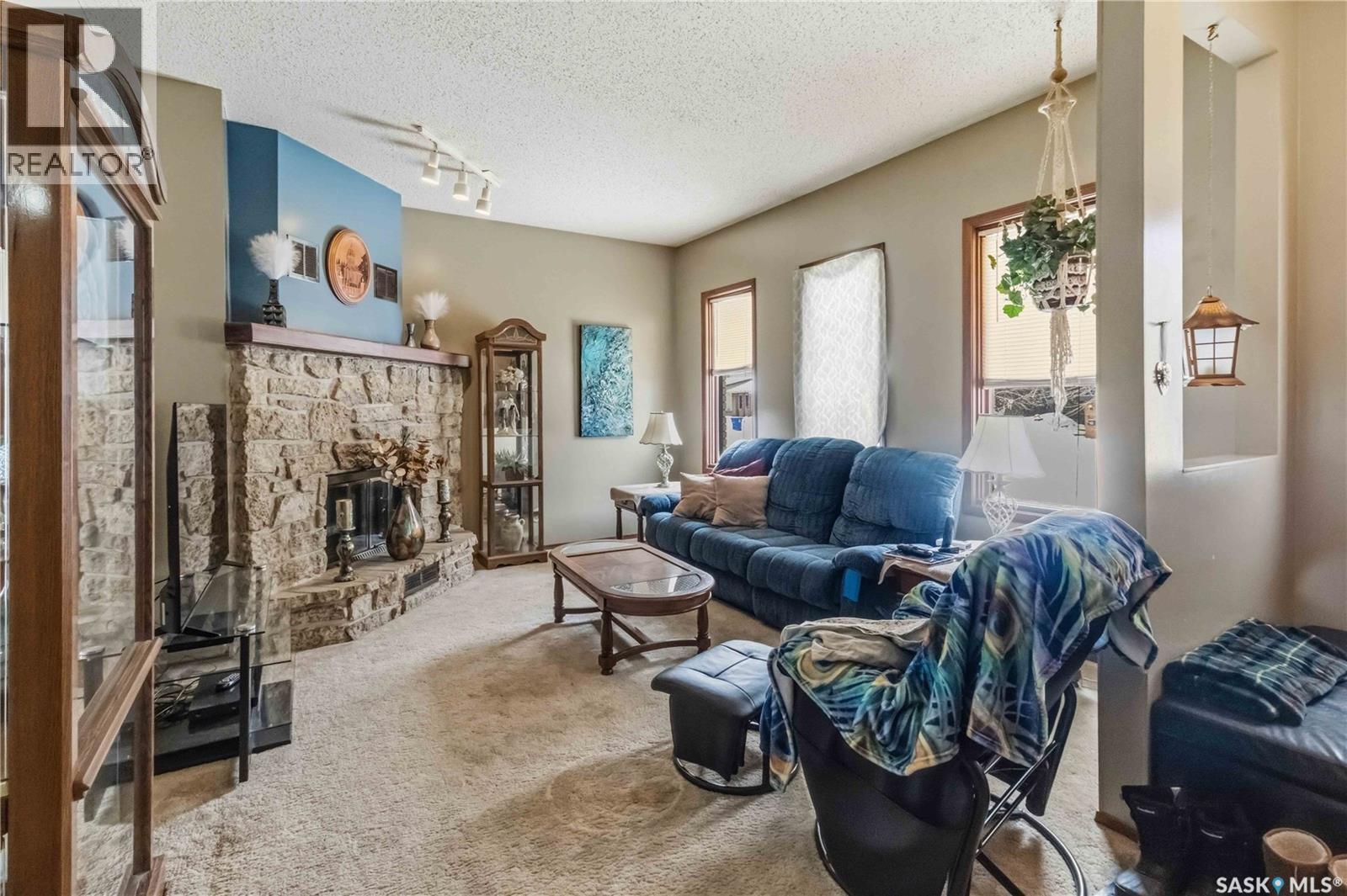 202 Verbeke Crescent, Saskatoon, SK - Indoor Photo Showing Living Room With Fireplace