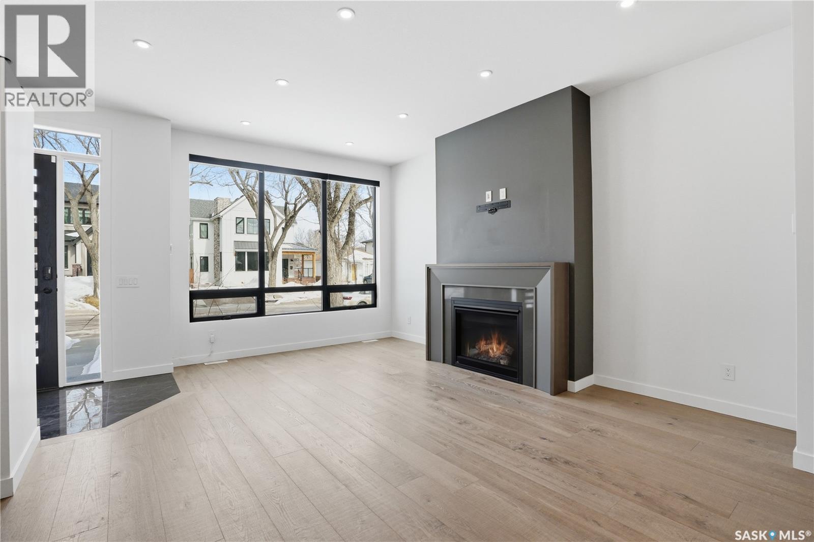 1312 15Th Street E, Saskatoon, SK - Indoor Photo Showing Living Room With Fireplace
