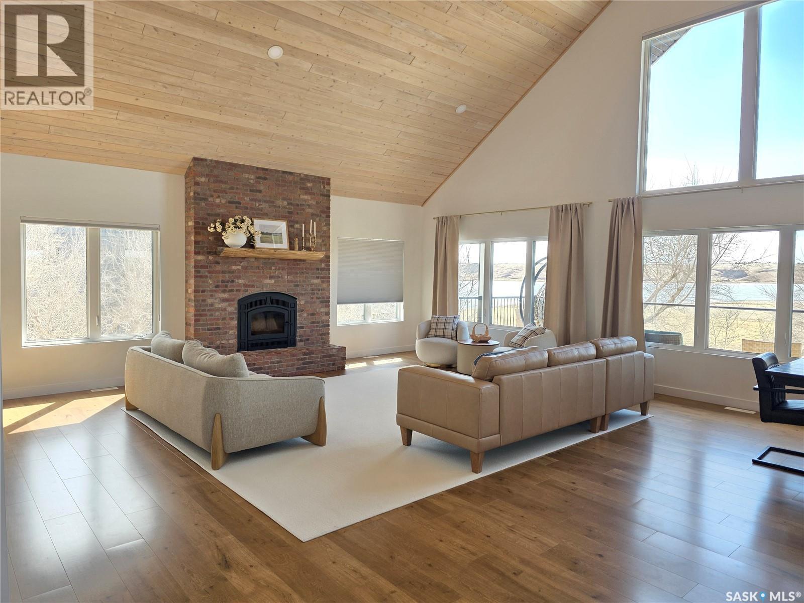 31 Willow Lane, Diefenbaker Lake, SK - Indoor Photo Showing Living Room With Fireplace