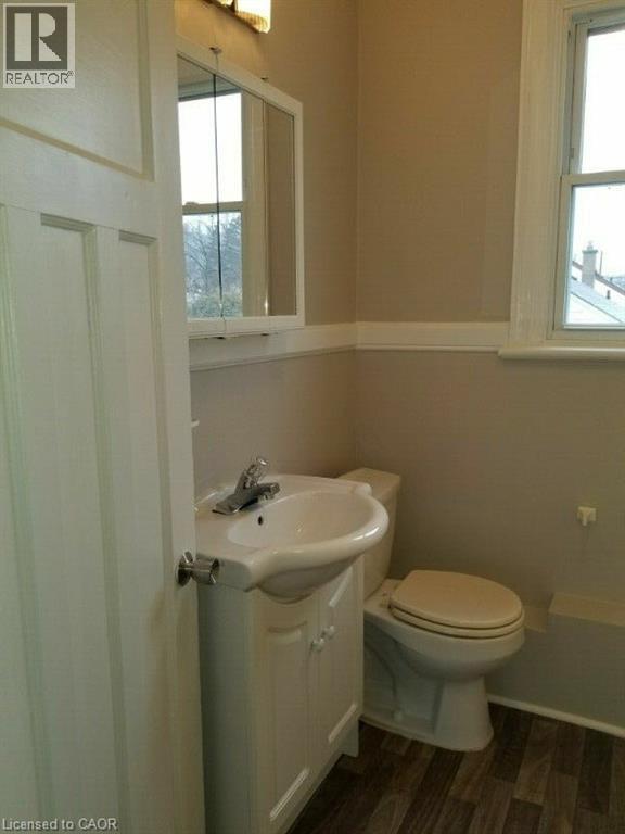 Half bathroom featuring vanity and dark wood-style flooring - 170 Stewartdale Avenue, Hamilton, ON - Indoor Photo Showing Bathroom