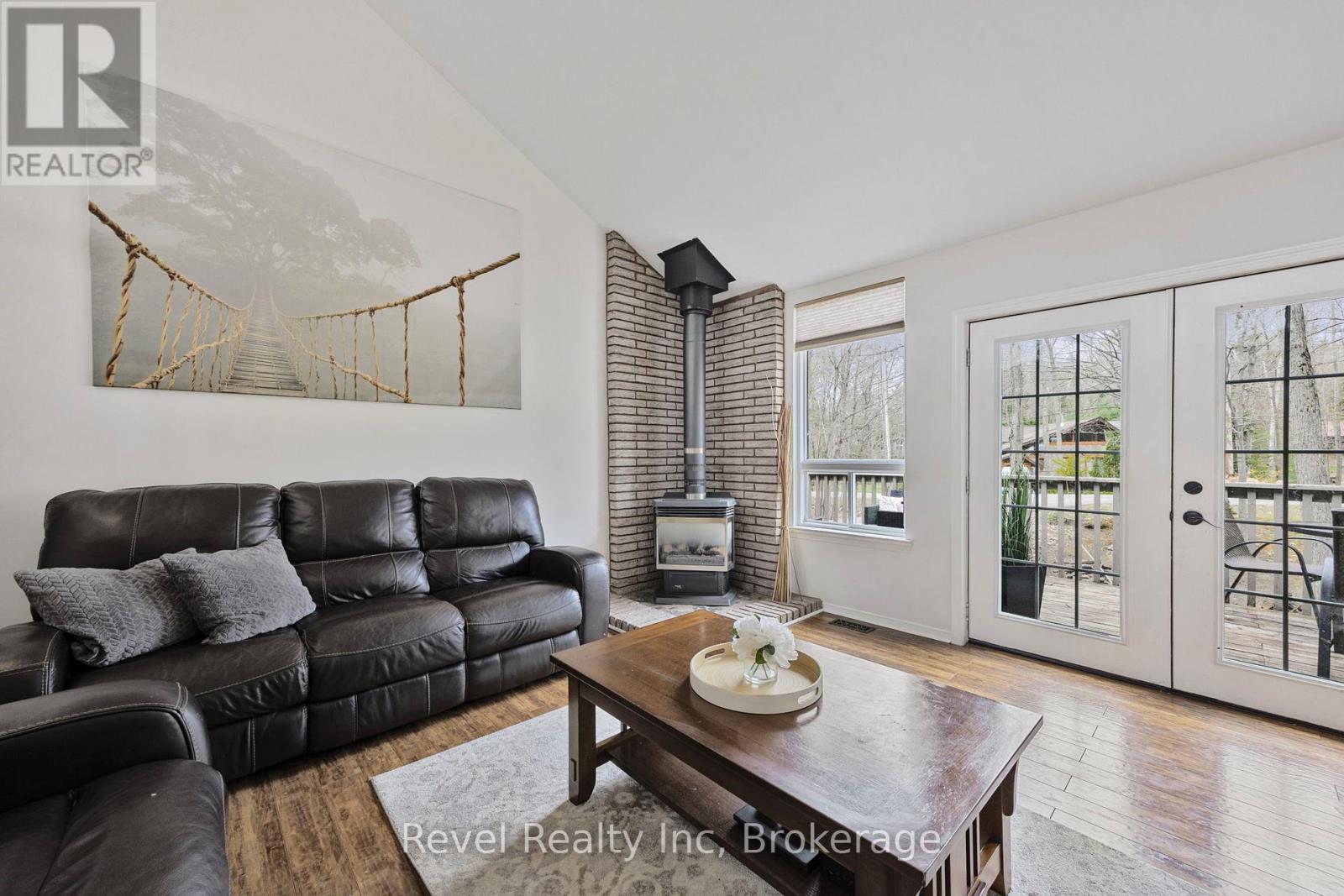 158 Desroches Trail, Tiny, ON - Indoor Photo Showing Living Room With Fireplace