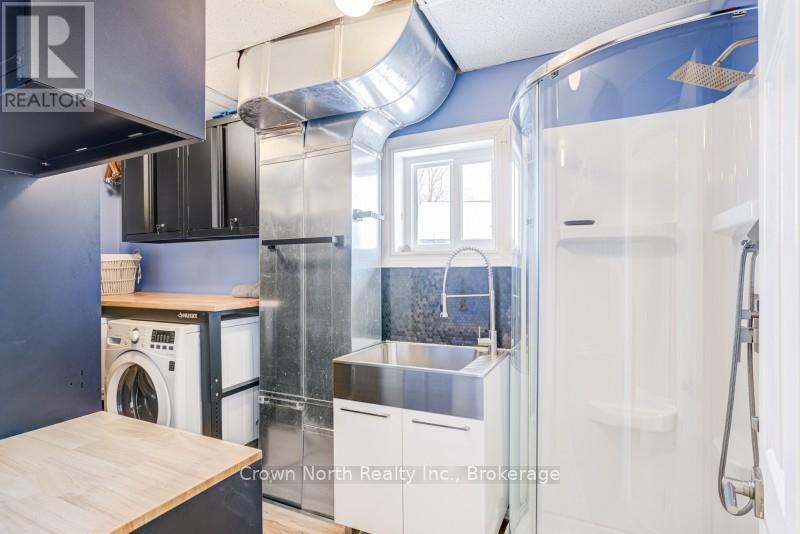 Main Floor Laundry with Large Sink and Shower - 39 Turtle Path, Ramara, ON - Indoor Photo Showing Laundry Room
