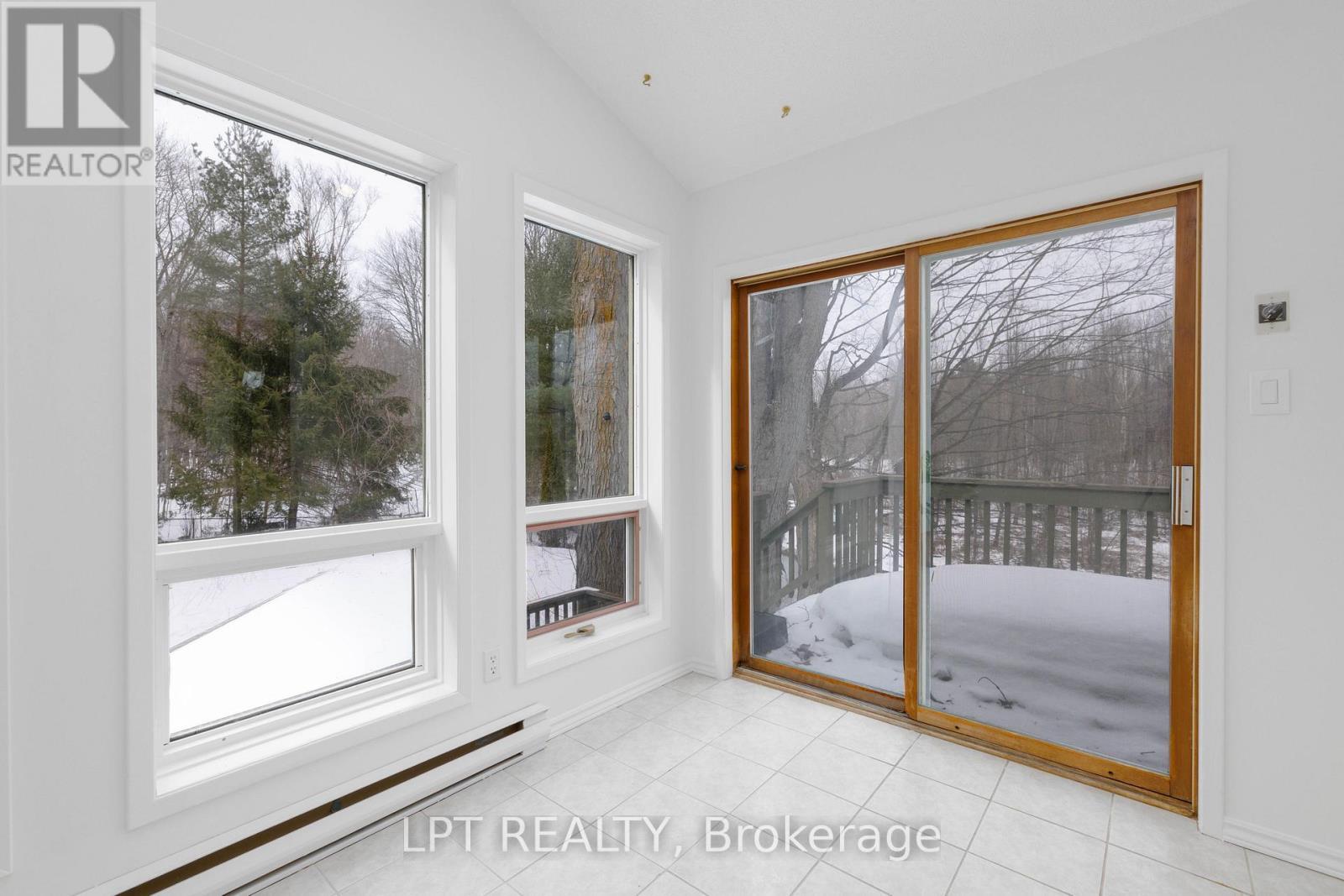 Sunroom With Walk-Out To Deck - 50 Concession Rd 2 W, Tiny, ON - Indoor Photo Showing Other Room